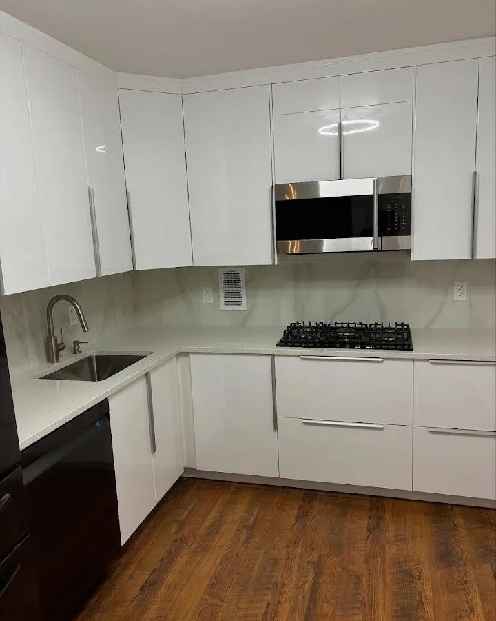 Restored kitchen with white cabinets after water damage in Lehman